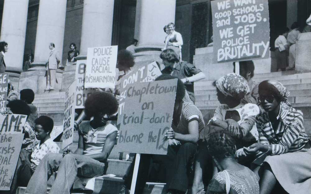 Demonstrators outside Leeds Crown Court on the first day of the trial of the Leeds Bonfire Night 12, June 1975. Photograph by Max Farrar © Max Farrer.