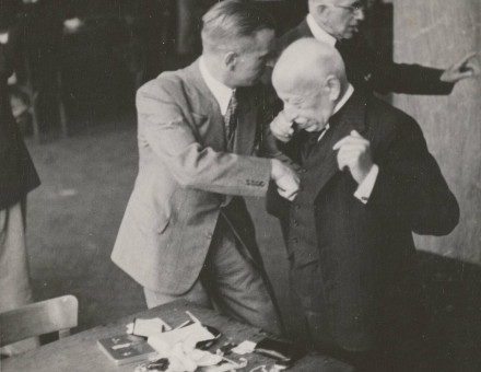 Jewish diamond merchants being searched at the Diamond Exchange, Amsterdam, 16 April 1942.